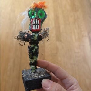 Colorful Handmade Figurine with Green and Orange Accents